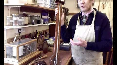 Can a magnet be used to remove the bubbles from a mercury tube?