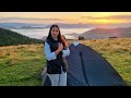 A woman is alone in the mountains. Cooking dinner and breakfast. Bushcraft camping