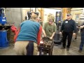 Team striking in blacksmith class at john c campbell folk school