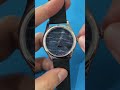 This wristwatch features a lighthouse beam as the minute hand and a ship at sea as the hour hand.