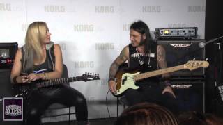 Chuck Garric and Nita Strauss at the Korg Booth at the 2015 NAMM expo.