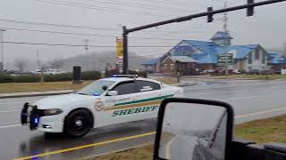 Sevier County Sheriff's Office Dodge Charger responding code 3 light rain and fog.