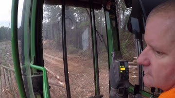 John Deere LOADING 10 Peterbilt log trucks first thing in the morning!