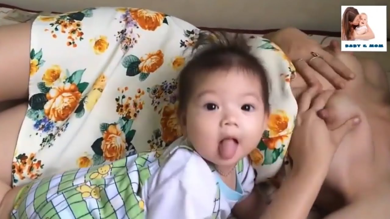 Beautyful breastfeeding mom breastfeeding for cute baby😘