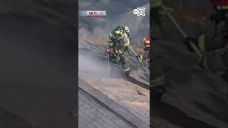 Firefighters use chainsaw to cut hole in roof during NW Houston fire
