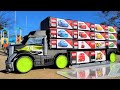 Colorful box is on a big truck. Please put the minicar in the same place as the photo