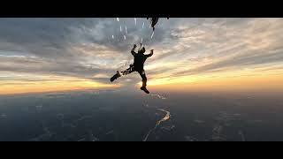 The U.S. Army Parachute Team jumps at Sunset over Washington Monument