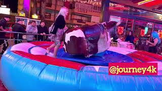 Beautiful Stranger Girl Riding On A Bull In Benidorm