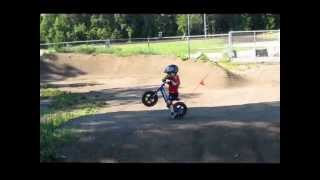 2 year old on his Strider bike at the BMX track