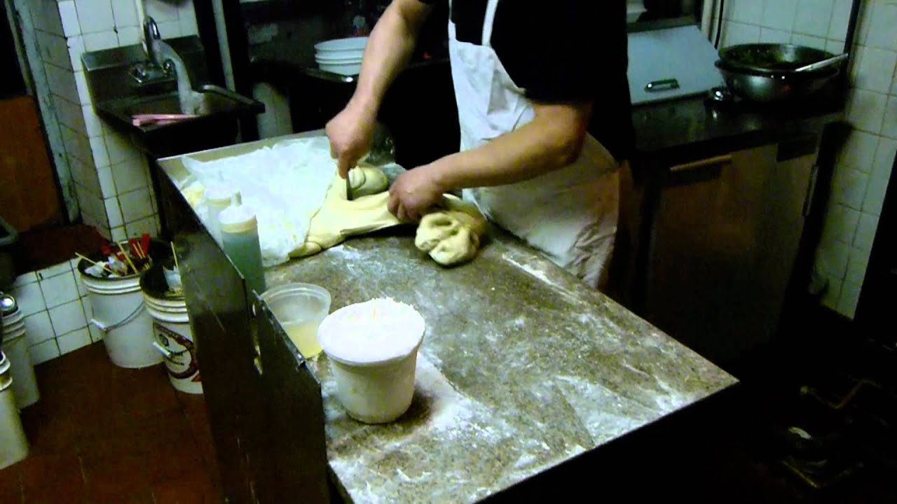 Making tasty hand pulled noodles in Chinatown