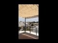 Palilleria pared - piso con toldo estor caida vertical