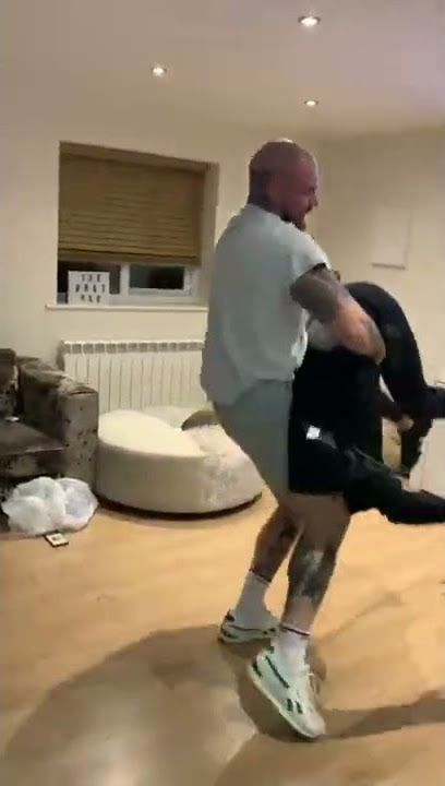 Guy gets body slammed on the couch!