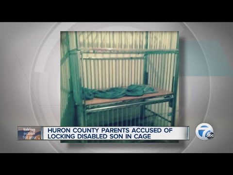 Huron County parents accused of locking disabled son in cage