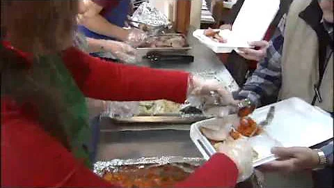 Volunteers up early to cook Thanksgiving meal for elderly