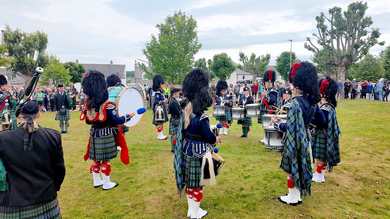 Ballater Pipe Band Drum Corps display before 2025 Tomintoul Highland Games in Moray Scotland