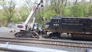 Wrecked engines from the 19G derailment being loaded onto flatcars!