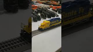 Lionel Santa Fe SD 18 #8872 pulling a Lionel 3359 operating twin dump car & a K-Line Timken Crane.