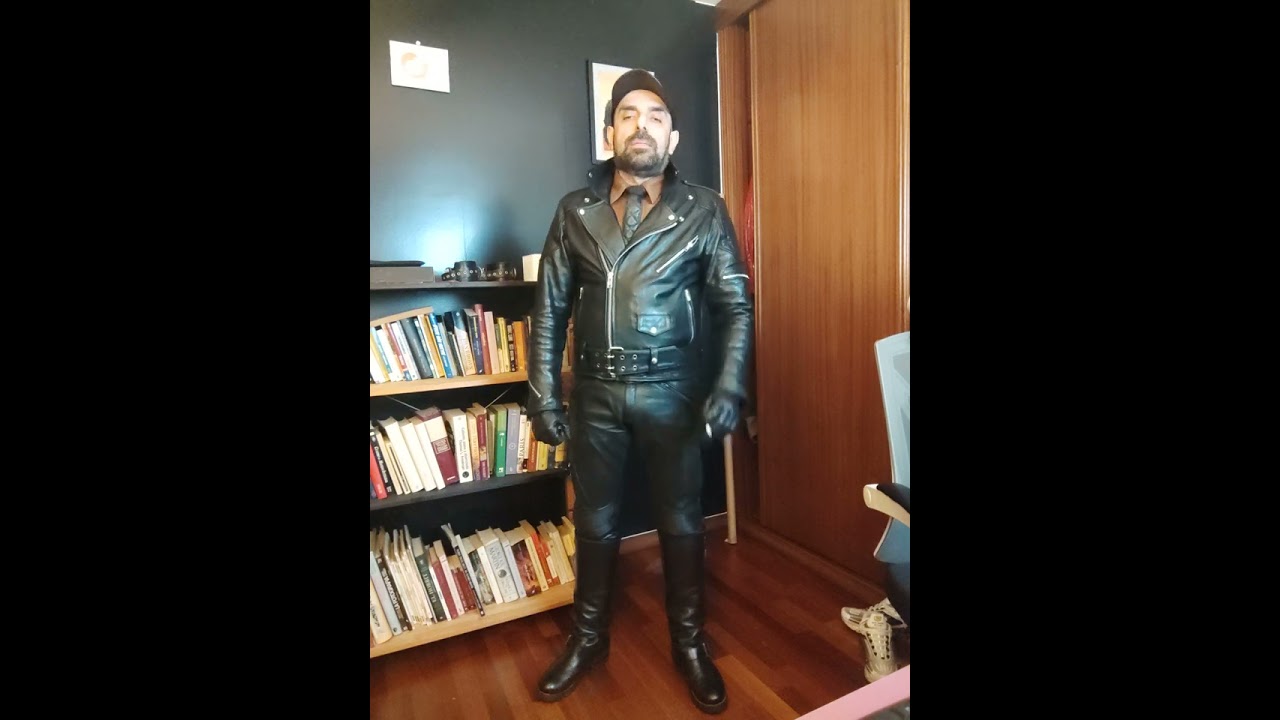 Smoking in full leather gear.