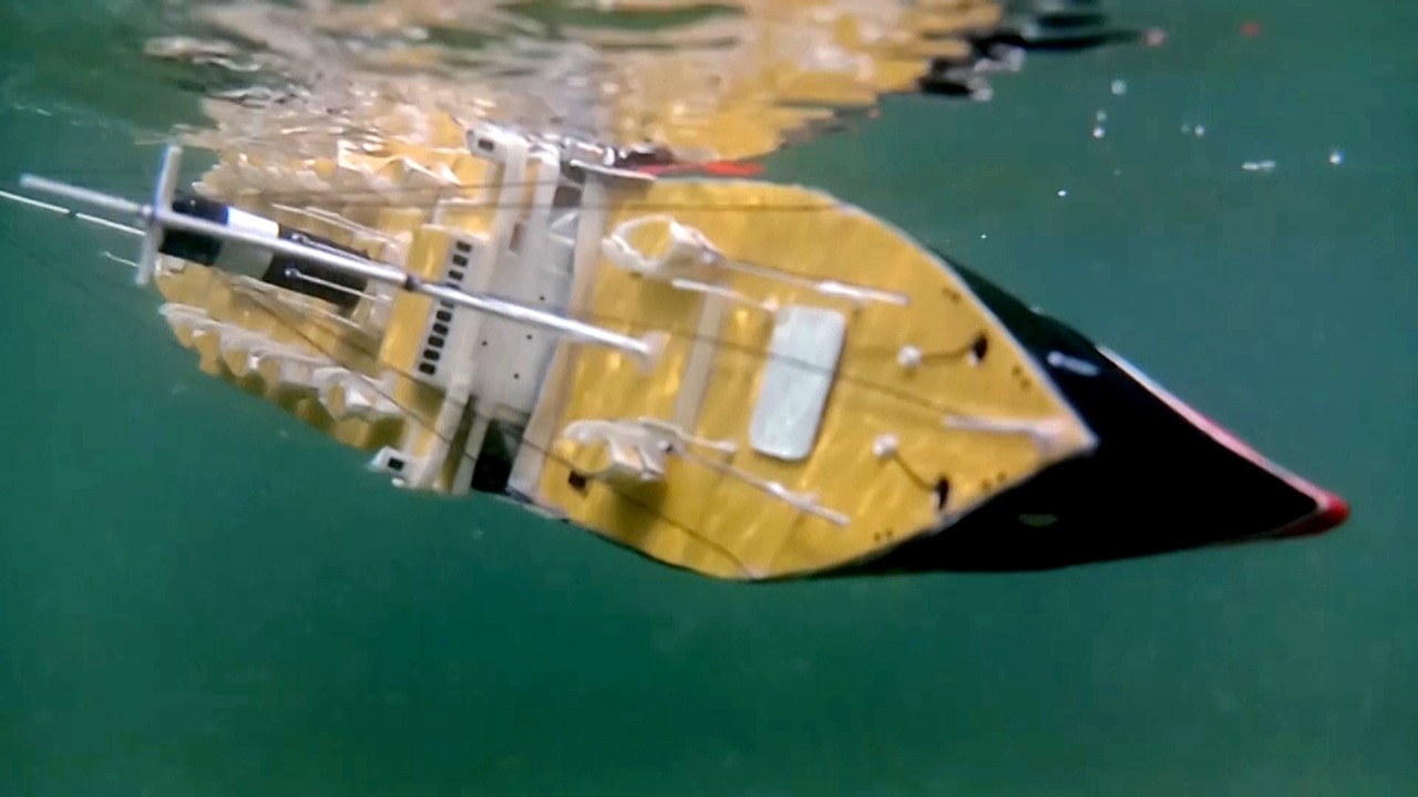 Cardboard ship sinking, Uboat torpedoed and sank model liner, mini shipwreck