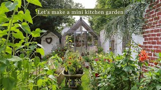 Create a mini budget kitchen garden in the cottage garden  using palette collars