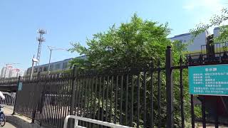 2 subway trains on Line 13 passing by each other at Lishuiqiao Station in Beijing, China