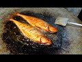 TWO big fish frying on pan