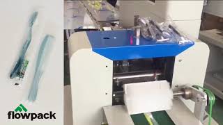 tooth paste and brush packing machine