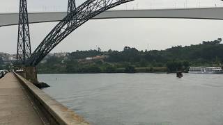 Tourist's boat sailing under Maria Pia and São João bridges — Porto, Portugal