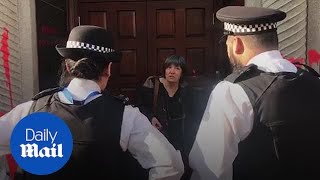 Extinction Rebellion activists glue themselves to Brazilian Embassy in London