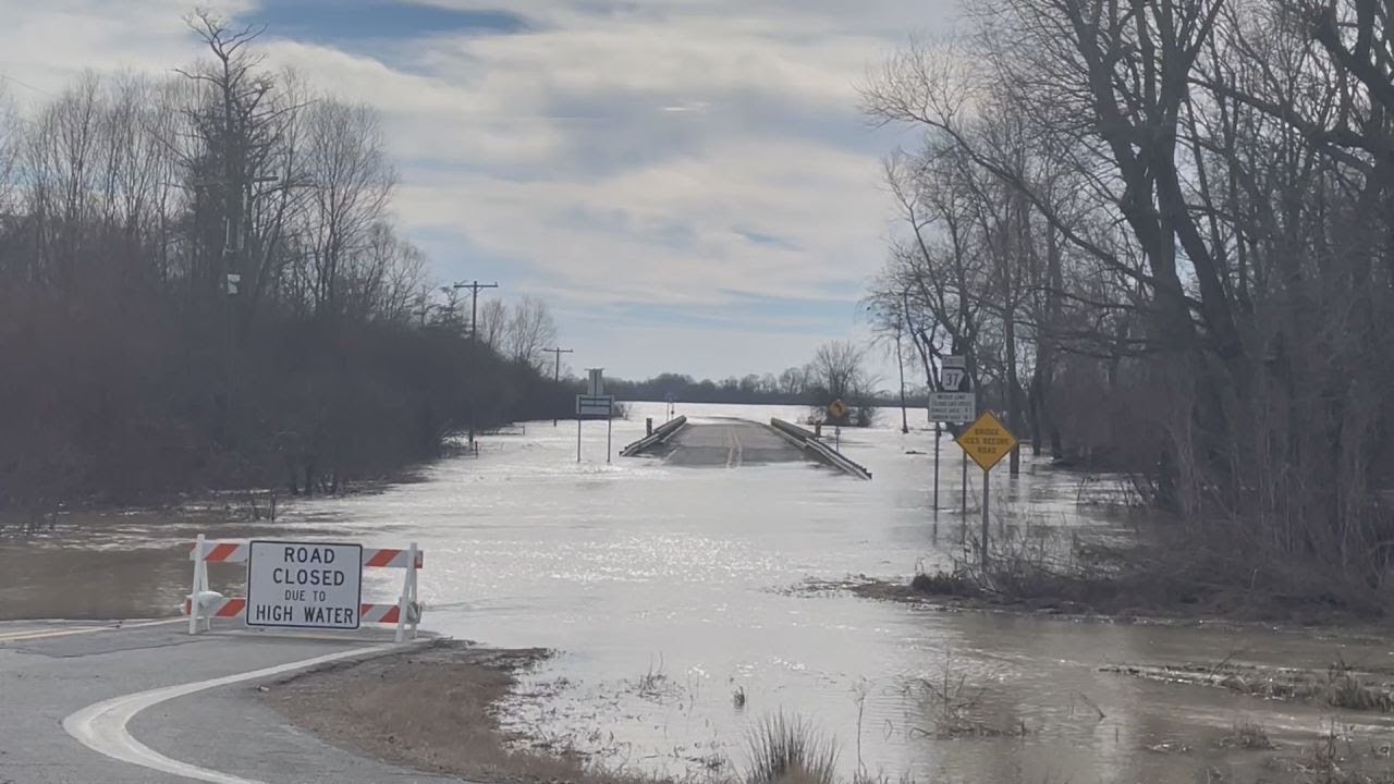 An already flooded community prepares for more rain - YouTube