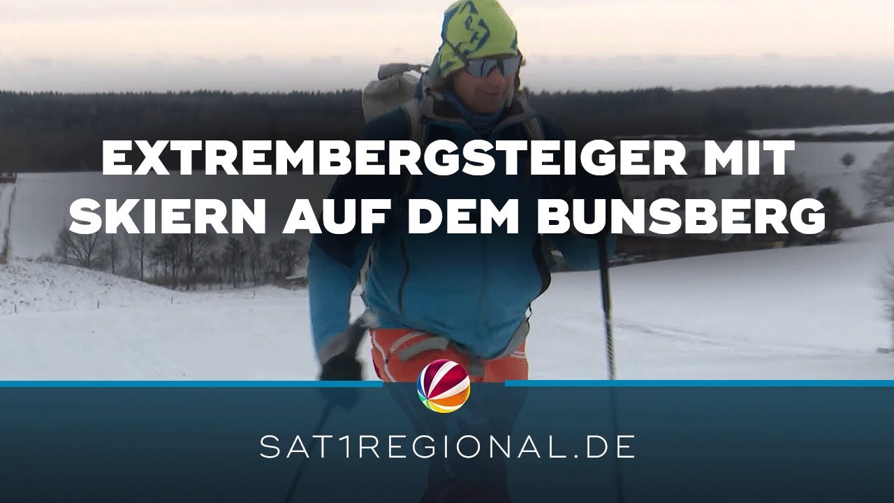 Extrembergsteiger aus Tirol erklimmt verschneiten Bungsberg und fährt mit Skiern hinunter
