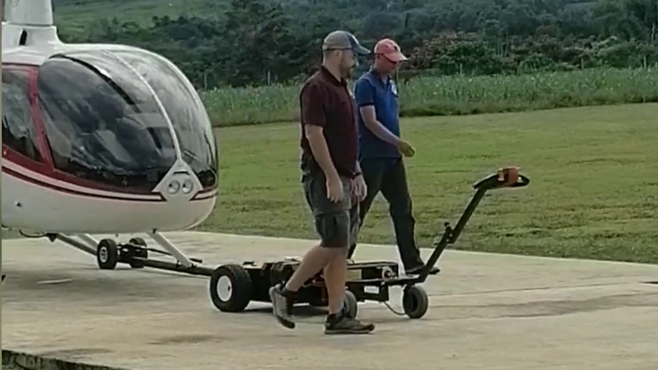 Robinson R66 helicopter, towing procedure in small battery cart - YouTube
