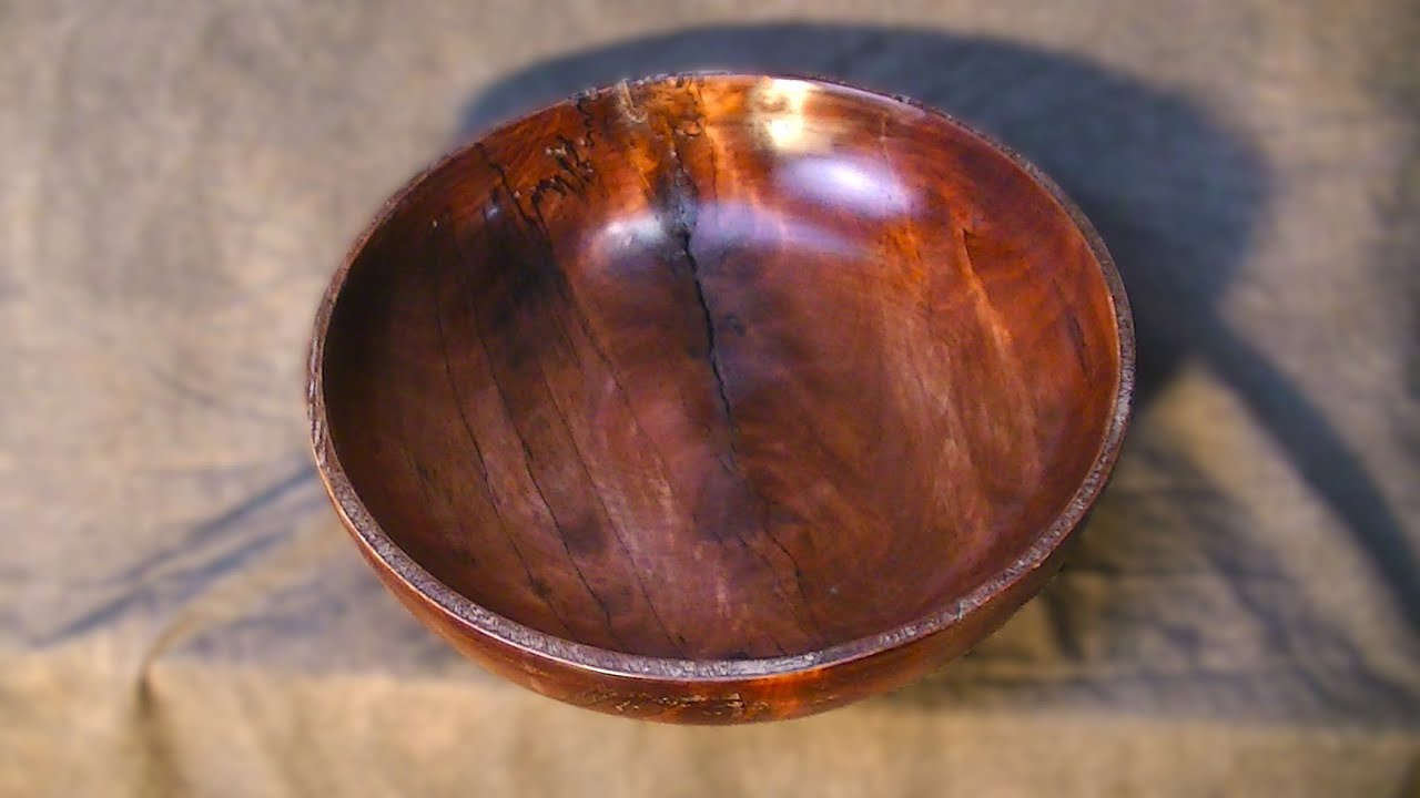 woodturning a birch bowl with red dye