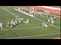 James Tringali dives for the pylon for St. Norbert