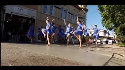 Kids dancing a in the street.