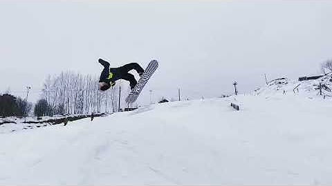 Barrel roll Backflip on a snowboard