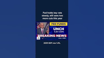 Fed holds key rate steady, still sees two more cuts this year