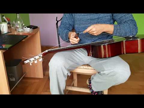 Βίντεο: Πώς να εισαγάγετε μια χορδή σε μια κιθάρα