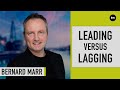 What is the difference between leading and lagging indicators?