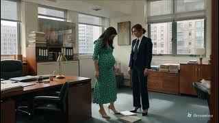 Lesbian kiss between two women in an office