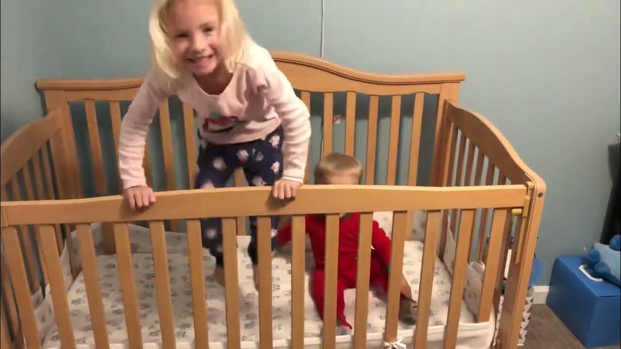 Siblings jumping up and down in the crib YouTube
