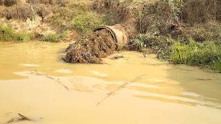Clearing a Flooded Outflow Packed with Garbage