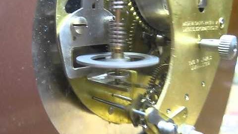 Smiths 8 day clock movement with a floating balance escapement.