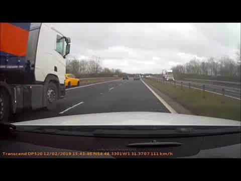Shocking moment maniac motorist drives on motorway hard shoulder at estimated 140mph