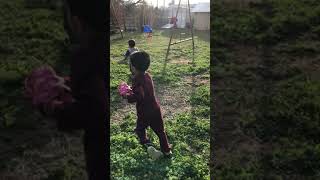 Boy hits baseball from batting tee then accidentally runs into a swinging swing
