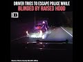 Driver Tries to Escape Police While Blinded by Raised Hood