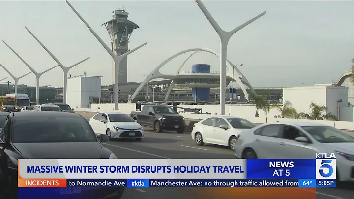 Holiday travelers brace for winter storm and record crowds