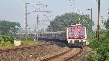 Pink color high speedy Katwa-Howrah Galloping Local Train passing 90° rail curve