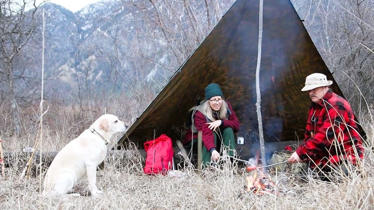 River Bushcraft.  Man. Woman. Dog.