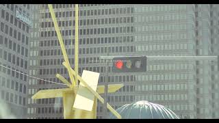 urban traffic light with sculpture and skyscrapers | Cinematic 4K B-Roll